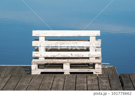 White painted wooden bench made from old pallets 101778662
