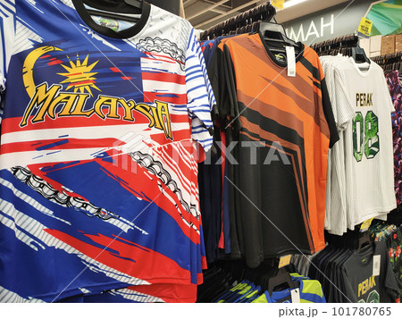 KUALA LUMPUR, MALAYSIA -JULY 8, 2022: Various types of adult men's clothes are hung and displayed for sale. Separated by type and fashion. Have a price tag for customer reference. KUALA LUMPUR, MALAYSIA -JULY 8, 2022: Various types of adult men's clothes are hung and displayed for sale. Separated by type and fashion. Have a price tag for customer reference. 101780765