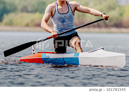 front view male athlete canoeist on canoe single rowing kayaking, summer outdoors sports front view male athlete canoeist on canoe single rowing kayaking, summer outdoors sports 101781545