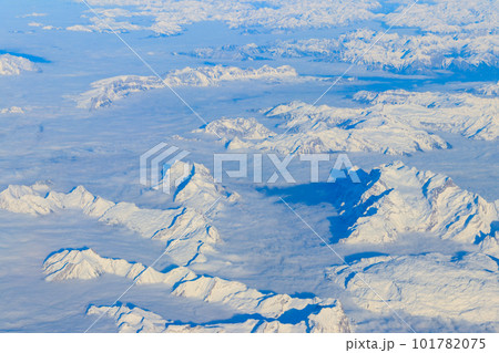 View of the Swiss Alps covered with snow from airplane 101782075