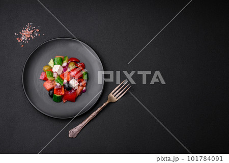 Delicious, fresh Greek salad with feta cheese, olives, tomatoes and cucumbers Delicious, fresh Greek salad with feta cheese, olives, tomatoes and cucumbers 101784091
