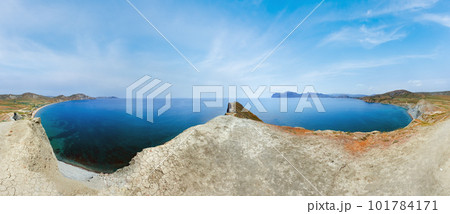 Summer rocky coastline and camping on sandy beach, Chameleon Cape, Crimea, Ukraine. All peoples and cars is unrecognizable. Summer rocky coastline and camping on sandy beach, Chameleon Cape, Crimea, Ukraine. All peoples and cars is unrecognizable. 101784171
