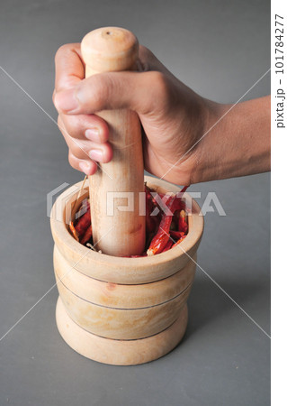 processing chili flakes in a bowl on table processing chili flakes in a bowl on table 101784277