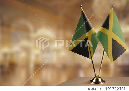 Small flags of the Jamaica on an abstract blurry background Small flags of the Jamaica on an abstract blurry background 101790561