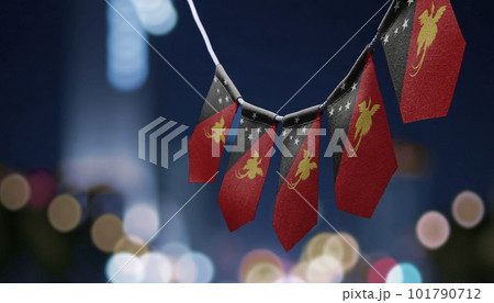 A garland of Papua New Guinea national flags on an abstract blurred background A garland of Papua New Guinea national flags on an abstract blurred background 101790712