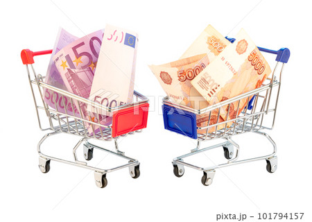 Euro bill bancnotes 500 and roubles 5000 in shopping carts Euro bill bancnotes 500 and roubles 5000 in shopping carts 101794157