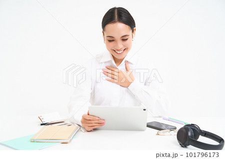 Image of saleswoman, asian entrepreneur talks on video chat from her office, has a meeting, connects to webinar online, white background Image of saleswoman, asian entrepreneur talks on video chat from her office, has a meeting, connects to webinar online, white background 101796173