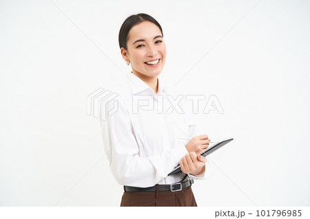 Corporate and young entrepreneurs concept. Successful businesswoman using digital tablet, prepares for meeting, looks at business concept on her gadget 101796985