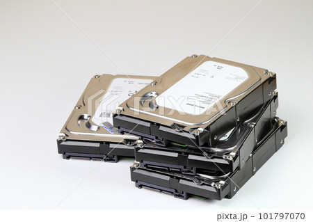 pile or stack of HDD, SSHD Hybrid hard disk drives 3.5" standard profile show on SATA interface, isolated on white background pile or stack of HDD, SSHD Hybrid hard disk drives 3.5" standard profile show on SATA interface, isolated on white background 101797070