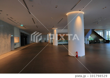 The Illuminated long and clean corridor of modern building, exhibition hall event or public trade show expo event in modern exhibition hall. The Illuminated long and clean corridor of modern building, exhibition hall event or public trade show expo event in modern exhibition hall. 101798529