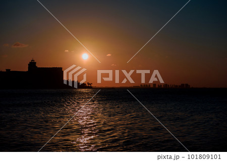 Sunrise or sunrise overlooking the sea and a line of hotels in Cancun 101809101