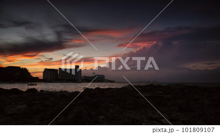 Sunrise or sunrise overlooking the sea and a line of hotels in Cancun 101809107