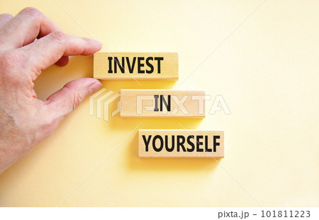 Invest in yourself symbol. Concept words Invest in yourself on wooden block on a beautiful white table white background. Businessman hand. Business and Invest in yourself concept. Copy space. Invest in yourself symbol. Concept words Invest in yourself on wooden block on a beautiful white table white background. Businessman hand. Business and Invest in yourself concept. Copy space. 101811223