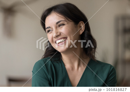 Portrait of beautiful young happy woman looking aside pose indoors Portrait of beautiful young happy woman looking aside pose indoors 101816827