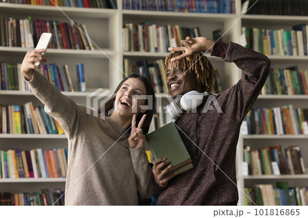 Two happy students make selfie in library Two happy students make selfie in library 101816865