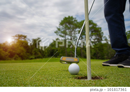 Blurred golfer playing golf in the evening golf course, on sun set evening time. 101817361