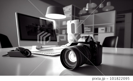 Photographer's workplace with a modern equipment. Mirrorless camera, laptop and prime lenses. Photographer's workplace with a modern equipment. Mirrorless camera, laptop and prime lenses. 101822095
