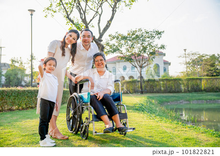 Asian family stay in garden in area of their home village with soft light in evening Asian family stay in garden in area of their home village with soft light in evening 101822821