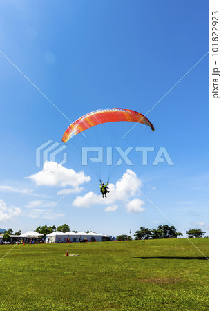 Paragliding extreme Sport with blue Sky and clouds in the background, at Luye highland in Taitung, Taiwan. 101822923