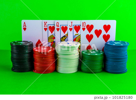 Poker chips in stacks and royal flush on the...の写真素材