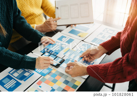 Creative team web designer planning application development for web mobile phone, laptop, smartphone and digital tablet at modern workplace. Creative team web designer planning application development for web mobile phone, laptop, smartphone and digital tablet at modern workplace. 101828061