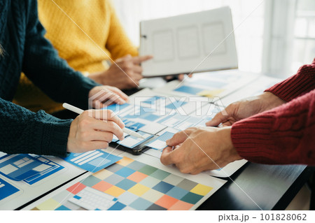Creative team web designer planning application development for web mobile phone, laptop, smartphone and digital tablet at modern workplace. Creative team web designer planning application development for web mobile phone, laptop, smartphone and digital tablet at modern workplace. 101828062