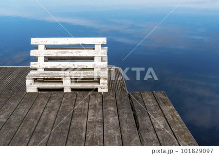 Bench made from old pallets on a wooden pier 101829097