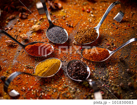 Spoons with different spices Spoons with different spices 101830083