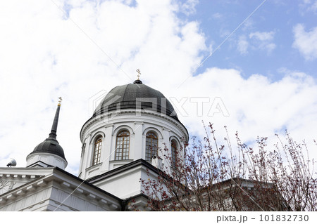 Radonitsa, also spelled Radunitsa, Radonica, or Radunica Concept. Orthodox Church Holiday. Church Dome With Cross Against Blue Sky With White Clouds Radonitsa, also spelled Radunitsa, Radonica, or Radunica Concept. Orthodox Church Holiday. Church Dome With Cross Against Blue Sky With White Clouds 101832730