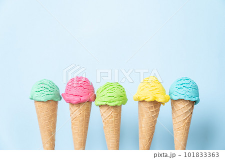 Colorful ice cream scoops in cones, bright blue background 101833363