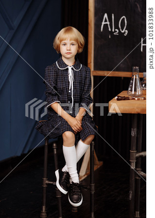 Schoolgirl doing a chemical experiment Schoolgirl doing a chemical experiment 101833988