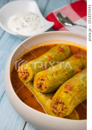 Recipe of stuffed courgette with tomato sauce, Lebanese style, Kouca Mehchi bi Banadoura, with Greek Recipe of stuffed courgette with tomato sauce, Lebanese style, Kouca Mehchi bi Banadoura, with Greek 101835041