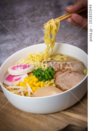Fresh ramen noodles with garnish, pork tenderloin, eggs marinated in Mirin and soy sauce, bean 101835044