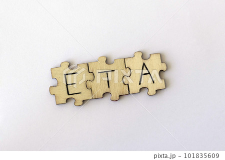 The acronym ETA, which stands for Estimated Time of Arrival. The letters written on the puzzles. 101835609