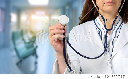 Medicine doctor with stethoscope in hand with the hospital background. Medical and Healthcare concept. 101835737