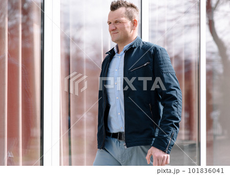 A confident business person in the city. Business vision, communications A confident business person in the city. Business vision, communications 101836041