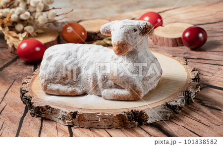 Easter sweet lamb cake, eggs on a wood background, stock photo Easter sweet lamb cake, eggs on a wood background, stock photo 101838582