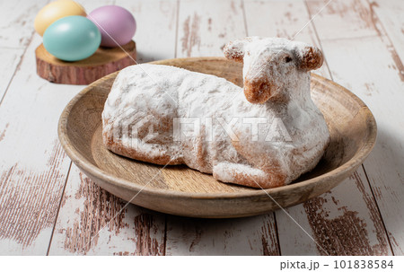 Easter sweet lamb cake, eggs on a wood background, stock photo Easter sweet lamb cake, eggs on a wood background, stock photo 101838584