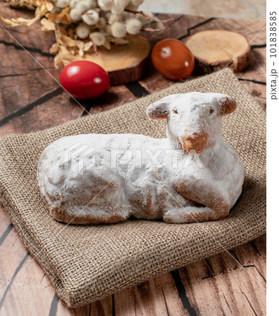 Easter sweet lamb cake, eggs on a wood background, stock photo	 101838585