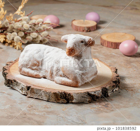Easter sweet lamb cake, eggs, willow, wood on old vintage background Easter sweet lamb cake, eggs, willow, wood on old vintage background 101838592