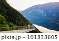 Young man standing on the viewing platform with drone controller view of Hallstatt lake, mountains 101838605