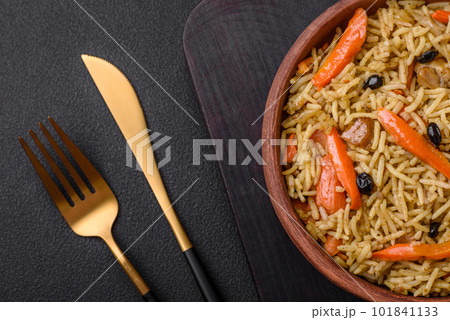 Delicious Uzbek pilaf with chicken, carrots, barberry, spices and herbs Delicious Uzbek pilaf with chicken, carrots, barberry, spices and herbs 101841133