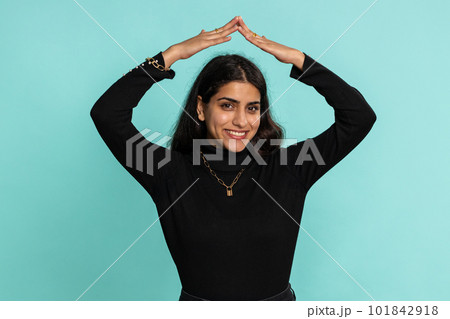 Woman playing catching up game, feeling in safe making roof above head, insurance, security service 101842918