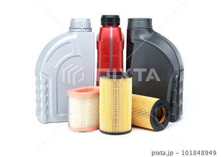 Car oil filters and motor oil cans over white 101848949
