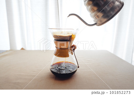 Pouring a hot water over a drip coffee Pouring a hot water over a drip coffee 101852273
