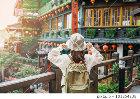 woman traveler visiting in Taiwan, Tourist with hat and backpack sightseeing in Jiufen Old Street village with Tea House background. landmark and popular attractions near Taipei city. Travel concept woman traveler visiting in Taiwan, Tourist with hat and backpack sightseeing in Jiufen Old Street village with Tea House background. landmark and popular attractions near Taipei city. Travel concept 101854239
