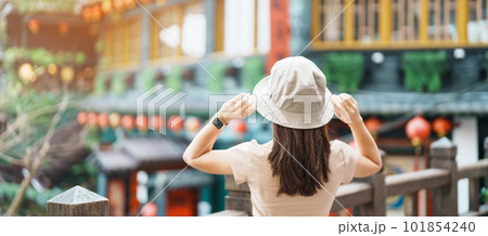 woman traveler visiting in Taiwan, Tourist with hat sightseeing in Jiufen Old Street village with Tea House background. landmark and popular attractions near Taipei city . Travel and Vacation concept woman traveler visiting in Taiwan, Tourist with hat sightseeing in Jiufen Old Street village with Tea House background. landmark and popular attractions near Taipei city . Travel and Vacation concept 101854240
