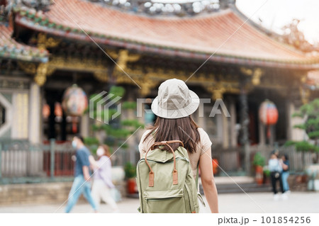 woman traveler visiting in Taiwan, Tourist with hat sightseeing in Longshan Temple, Chinese folk religious temple in Wanhua District, Taipei City. landmark and popular. Travel and Vacation concept woman traveler visiting in Taiwan, Tourist with hat sightseeing in Longshan Temple, Chinese folk religious temple in Wanhua District, Taipei City. landmark and popular. Travel and Vacation concept 101854256