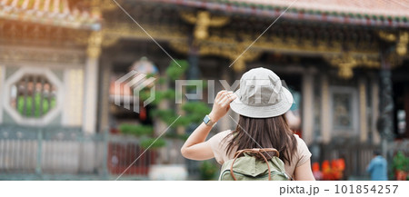 woman traveler visiting in Taiwan, Tourist with hat sightseeing in Longshan Temple, Chinese folk religious temple in Wanhua District, Taipei City. landmark and popular. Travel and Vacation concept woman traveler visiting in Taiwan, Tourist with hat sightseeing in Longshan Temple, Chinese folk religious temple in Wanhua District, Taipei City. landmark and popular. Travel and Vacation concept 101854257