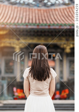 woman traveler visiting in Taiwan, Tourist with hat sightseeing in Longshan Temple, Chinese folk religious temple in Wanhua District, Taipei City. landmark and popular. Travel and Vacation concept woman traveler visiting in Taiwan, Tourist with hat sightseeing in Longshan Temple, Chinese folk religious temple in Wanhua District, Taipei City. landmark and popular. Travel and Vacation concept 101854259